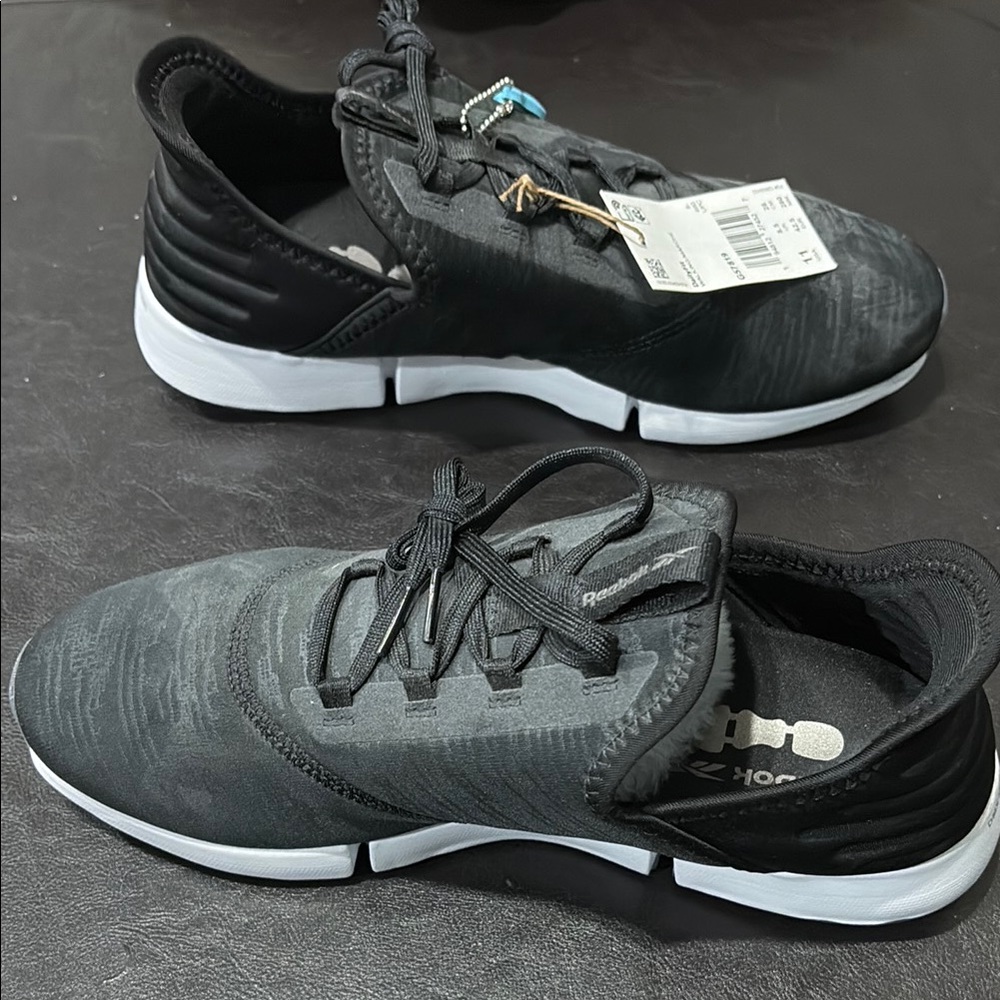 Reebok Black and White Athletic Shoes with Modern Mesh Design